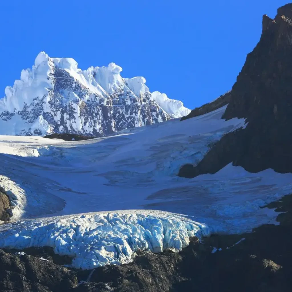 A stunning glacier nestled between towering peaks.