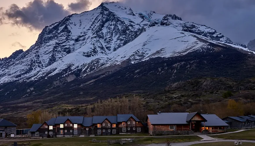 The façade of Hotel Las Torres Patagonia blends perfectly with the natural landscape.