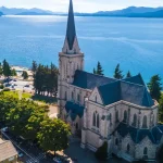 Bariloche cathedral and Lake Nahuel Huapi seen from above, with the Andes in the background
