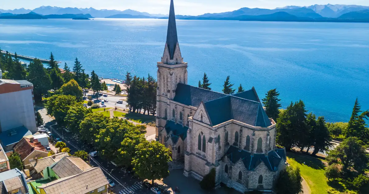 Bariloche cathedral and Lake Nahuel Huapi seen from above, with the Andes in the background