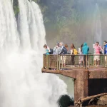 Visitors on a viewing platform beside the waterfalls at Iguazu Falls Argentina