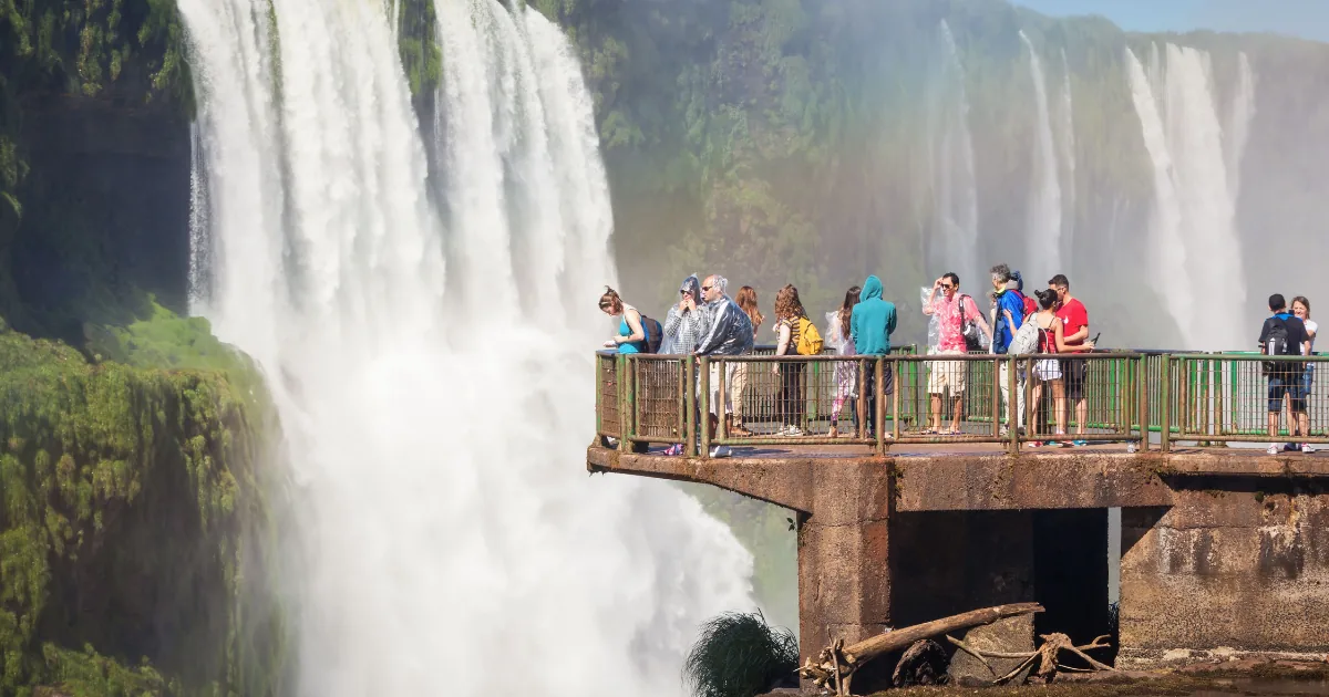 Visitors on a viewing platform beside the waterfalls at Iguazu Falls Argentina