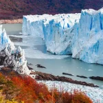 Perito Moreno Glacier ice wall above Lago Argentino with autumn forest, El Calafate, Santa Cruz, Patagonia Argentina
